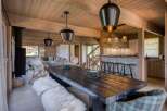 This stunning property boasts a rustic dining area, perfect for hosting gatherings.