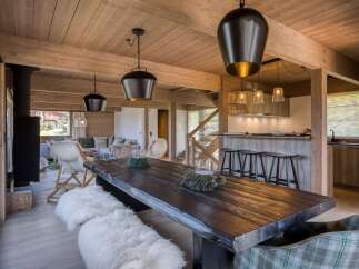 This stunning property boasts a rustic dining area, perfect for hosting gatherings.