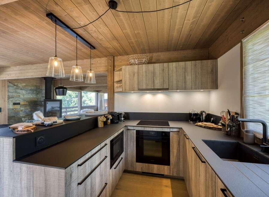 This stunning kitchen boasts a modern design with a rustic touch, perfect for any home.