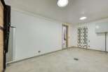 This modern space features a clean, minimalist design with bright white walls and recessed lighting.