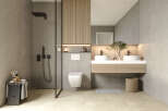 This modern bathroom boasts a sleek design with a walk-in shower, floating vanity, and a wall-mounted toilet.