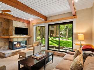 Step into luxury with this stunning property featuring a cozy fireplace and a spacious living area.