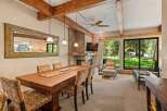 This stunning dining room features a beautiful wooden dining table and chairs, perfect for hosting gatherings.