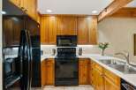 This stunning kitchen boasts beautiful wooden cabinetry and modern appliances.