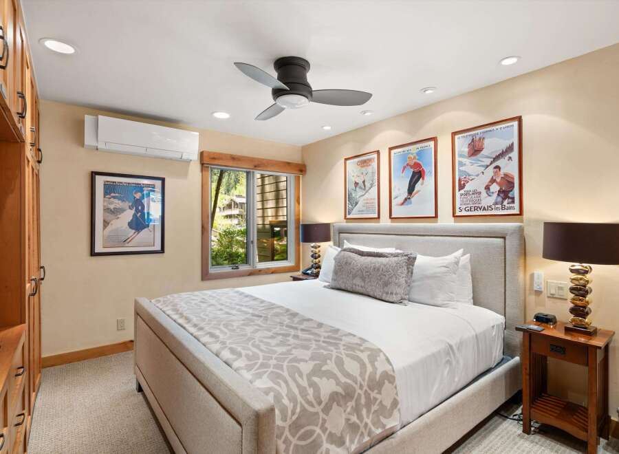 This cozy bedroom features a comfortable bed with a stylish headboard, perfect for a relaxing retreat.