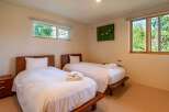 This cozy bedroom features two twin beds, perfect for guests or family members.