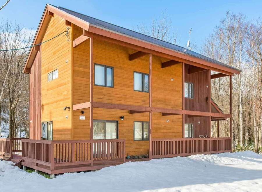 This stunning wooden house offers a warm and inviting atmosphere.