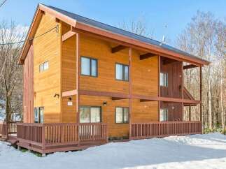 This stunning wooden house offers a warm and inviting atmosphere.