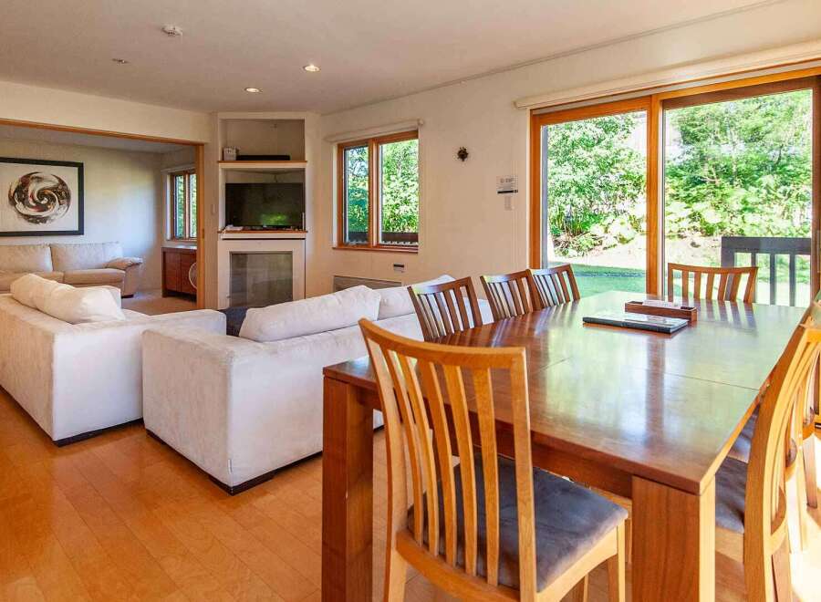 This stunning property boasts a spacious living area with a modern design.