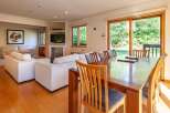 This stunning property boasts a spacious living area with a modern design.
