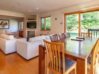 This stunning property boasts a spacious living area with a modern design.