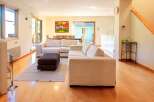 This stunning property boasts a spacious living area, perfect for entertaining or relaxing.