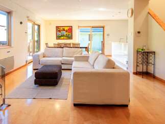 This stunning property boasts a spacious living area, perfect for entertaining or relaxing.