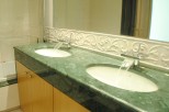 Indulge in luxury with this stunning bathroom featuring dual sinks and a sleek, modern design.