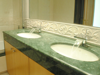 Indulge in luxury with this stunning bathroom featuring dual sinks and a sleek, modern design.