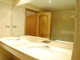 Luxury bathroom with double sinks and marble countertops.