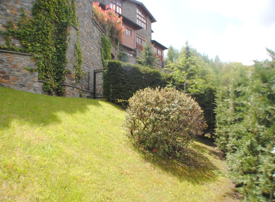 Nestled in a lush green landscape, this stone house offers stunning views and a tranquil atmosphere.
