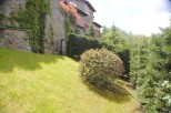 Nestled in a lush green landscape, this stone house offers stunning views and a tranquil atmosphere.