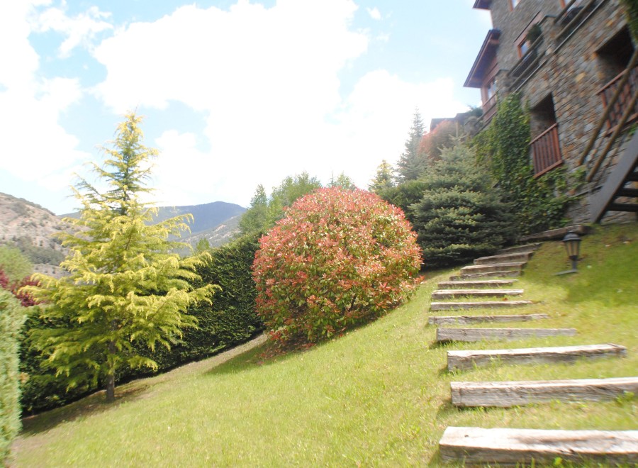Mountainside property with stunning views and meticulously landscaped gardens.