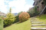 Mountainside property with stunning views and meticulously landscaped gardens.