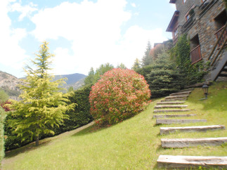 Mountainside property with stunning views and meticulously landscaped gardens.