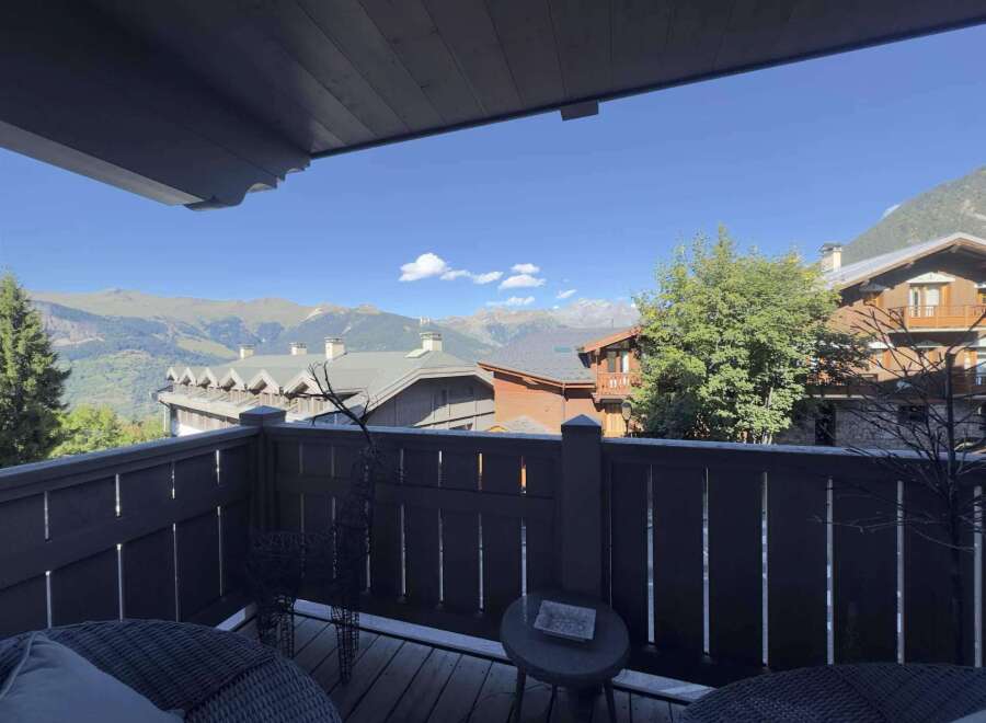 Enjoy breathtaking mountain views from this charming balcony.