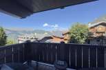 Enjoy breathtaking mountain views from this charming balcony.