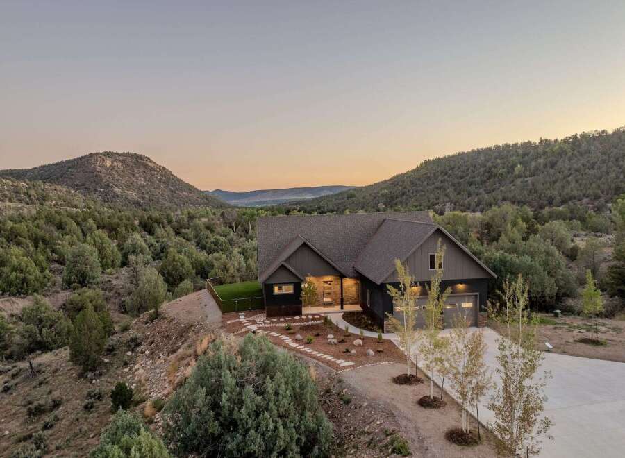 Nestled amidst the serene landscape, this stunning property offers a perfect blend of modern design and natural beauty.