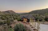 Nestled amidst the serene landscape, this stunning property offers a perfect blend of modern design and natural beauty.