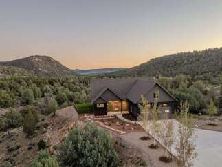 Nestled amidst the serene landscape, this stunning property offers a perfect blend of modern design and natural beauty.