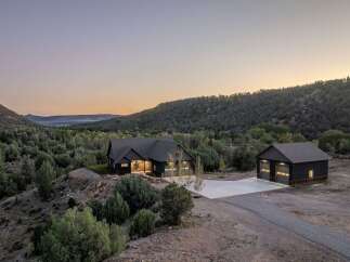 Nestled in a serene landscape, this stunning property offers a perfect blend of modern design and natural beauty.