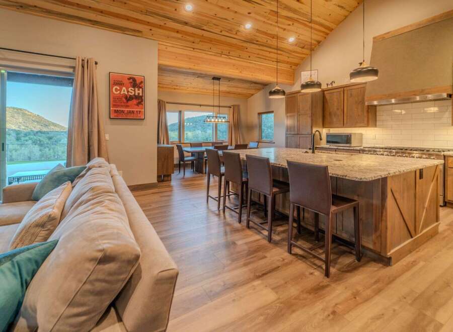 Experience luxury living in this stunning property featuring a gourmet kitchen with a large island and high-end appliances.