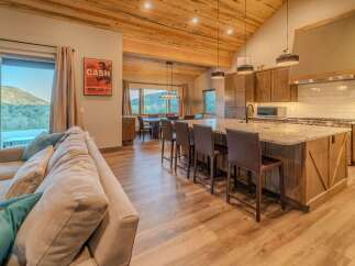 Experience luxury living in this stunning property featuring a gourmet kitchen with a large island and high-end appliances.