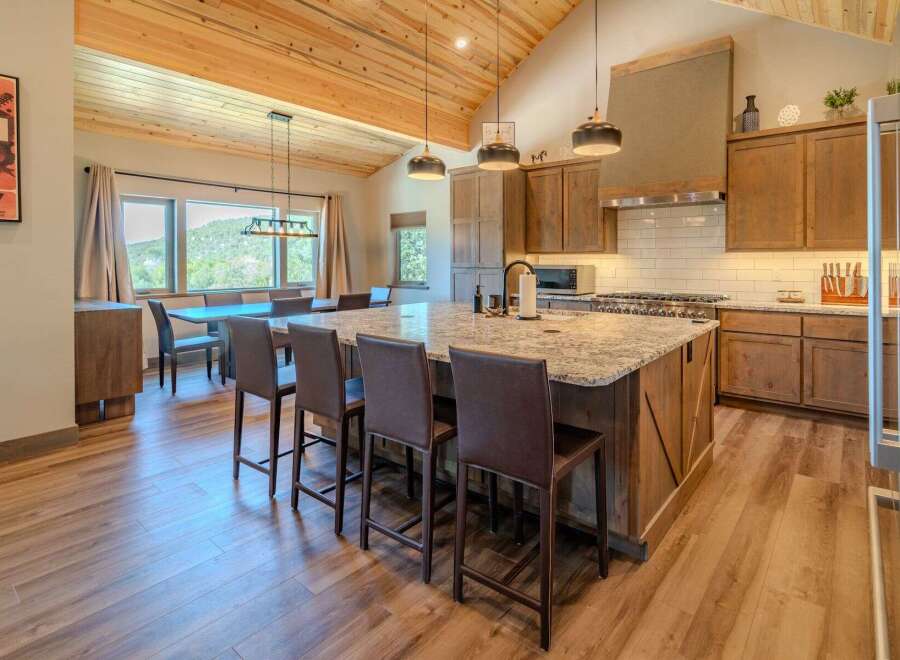 This stunning kitchen boasts a spacious island with seating, perfect for entertaining.