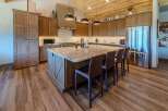 This stunning kitchen boasts a spacious island with seating, perfect for entertaining or casual dining.