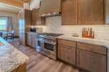 This stunning kitchen boasts a modern design with high-end appliances and ample counter space.