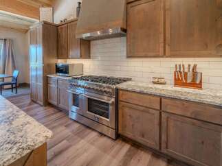 This stunning kitchen boasts a modern design with high-end appliances and ample counter space.