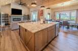 Experience luxury living in this stunning property featuring a spacious kitchen island with granite countertops, perfect for culinary creations and entertaining.