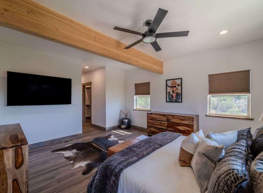 Step into luxury with this stunning bedroom featuring a modern design and rustic accents.