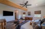 Step into luxury with this stunning bedroom featuring a modern design and rustic accents.