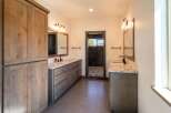 Step into luxury with this stunning bathroom featuring dual vanities and a spacious design.