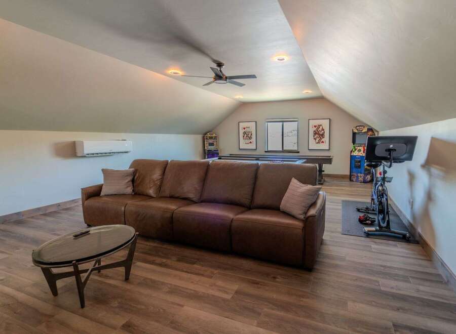 This stunning property boasts a spacious loft area, perfect for relaxation and entertainment.