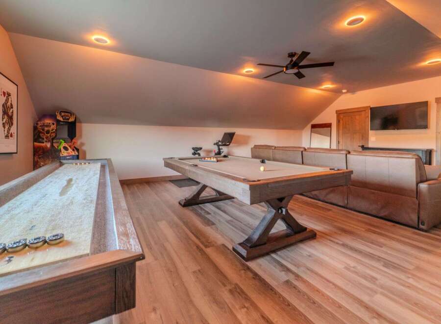 This stunning property boasts a spacious game room, perfect for entertaining guests or enjoying quality time with family.