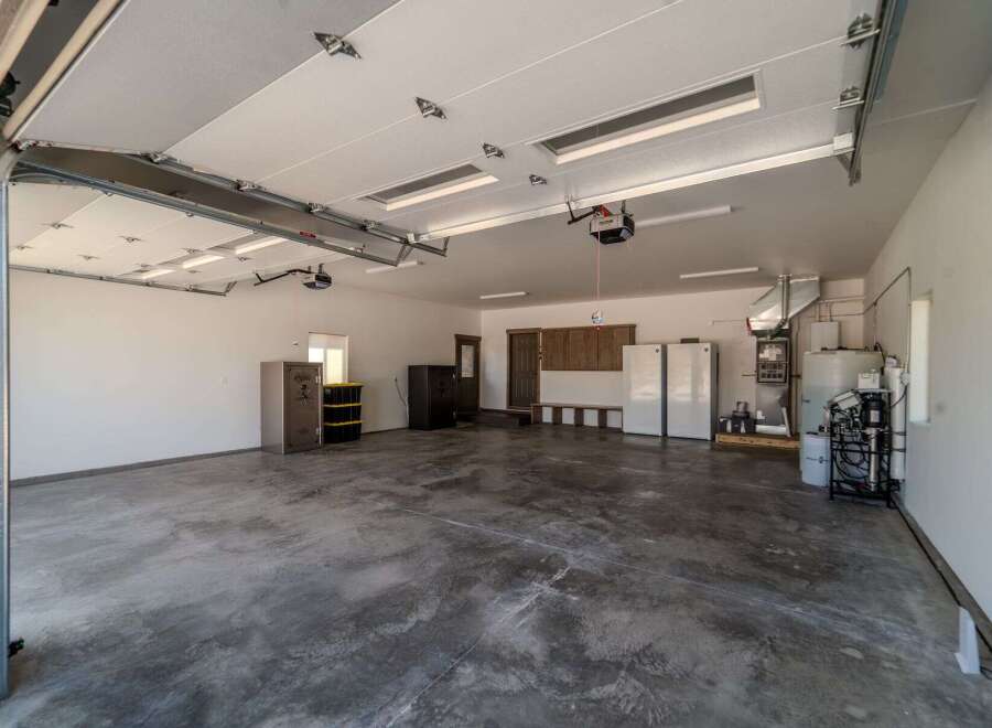 This spacious garage offers ample room for vehicles and storage.