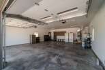 This spacious garage offers ample room for vehicles and storage.