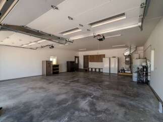 This spacious garage offers ample room for vehicles and storage.