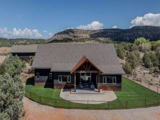 This stunning property boasts a modern design with a touch of rustic charm, offering a perfect blend of luxury and comfort.