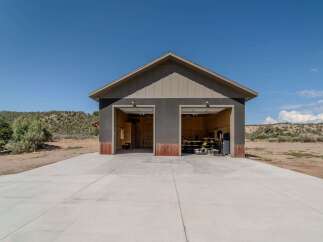 Discover this stunning property featuring a spacious two-car garage, perfect for car enthusiasts or extra storage.