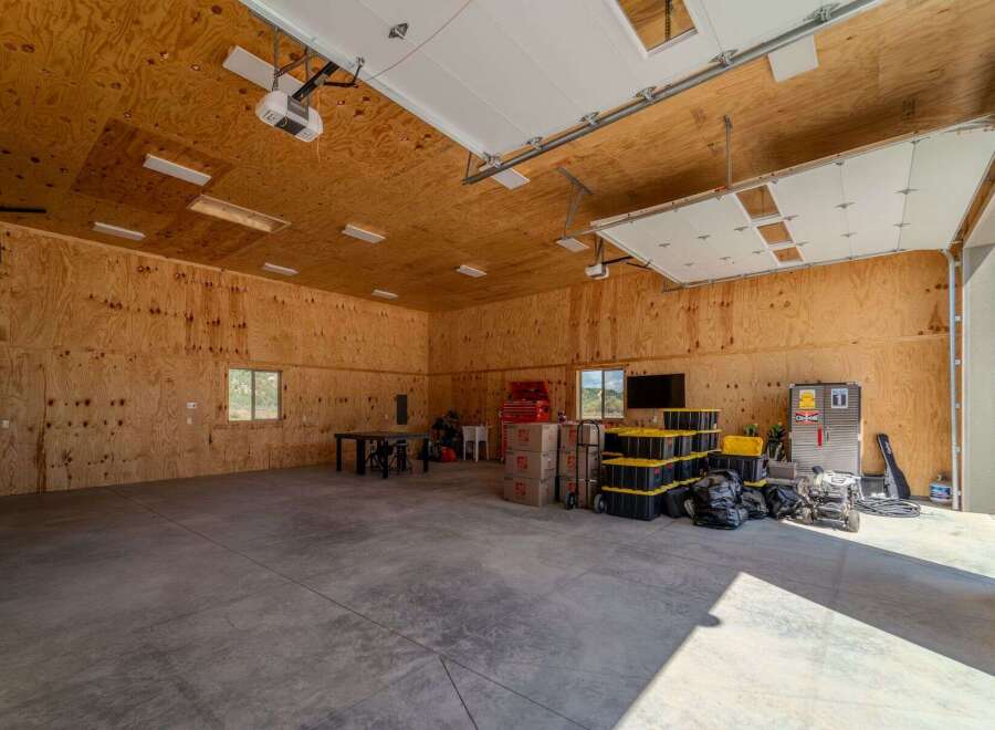 Spacious garage with ample storage and workspace.