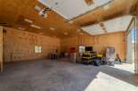 Spacious garage with ample storage and workspace.